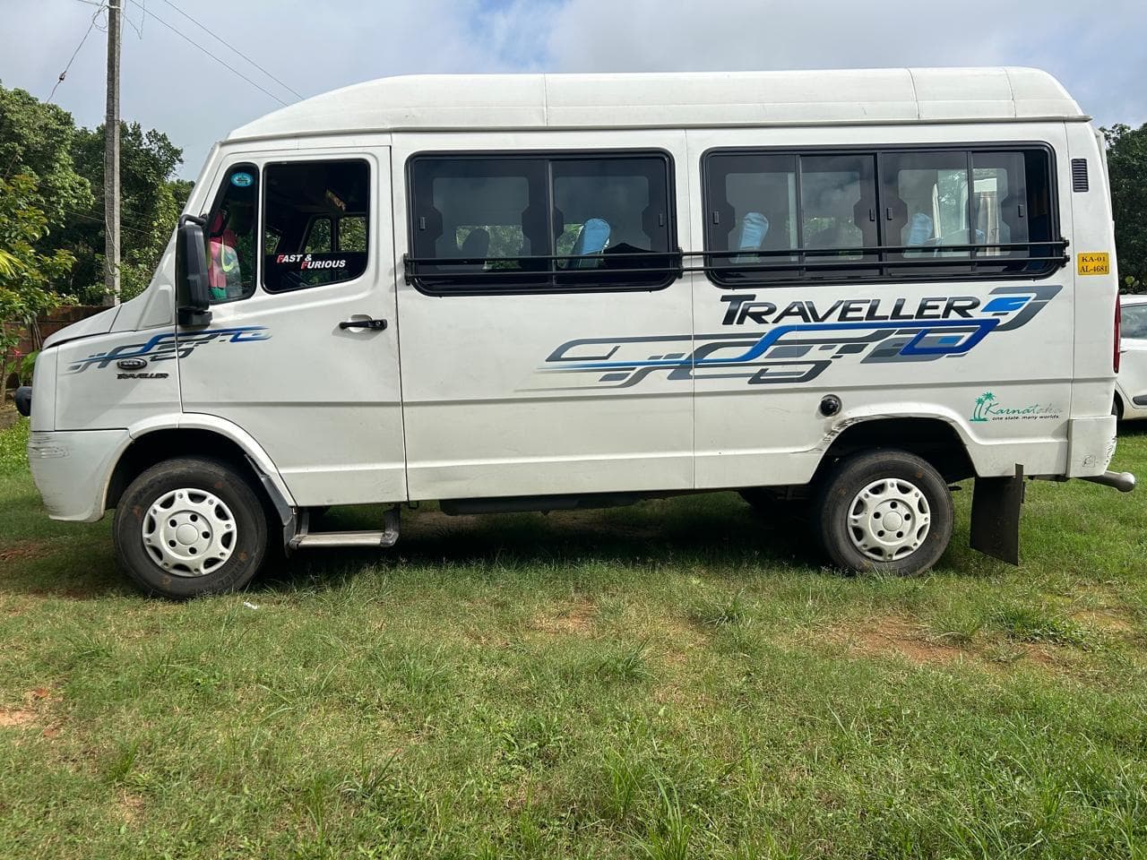Tempo Traveller parked on a trip